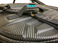 Spare tire storage bag sitting inside inverted off road wheel