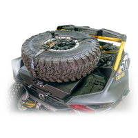 Installed Maverick R tire carrier rack, supports spare and gear for overlanding