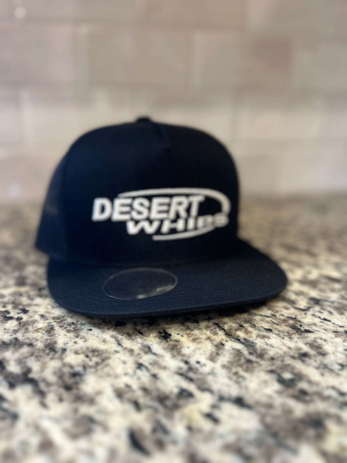 white emboidery black cap